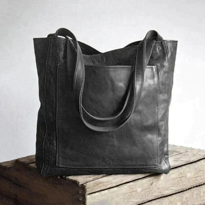 Zwarte veganistische leren schoudertas voor vrouwen, stijlvol accessoire, ruimte voor al je spullen.