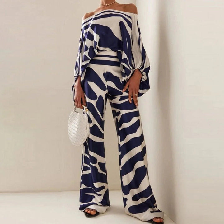 Dames tweedelige off-shoulder set met wijde pijpen broek, ideaal voor zomerse dagen. Comfortabel en modieus.