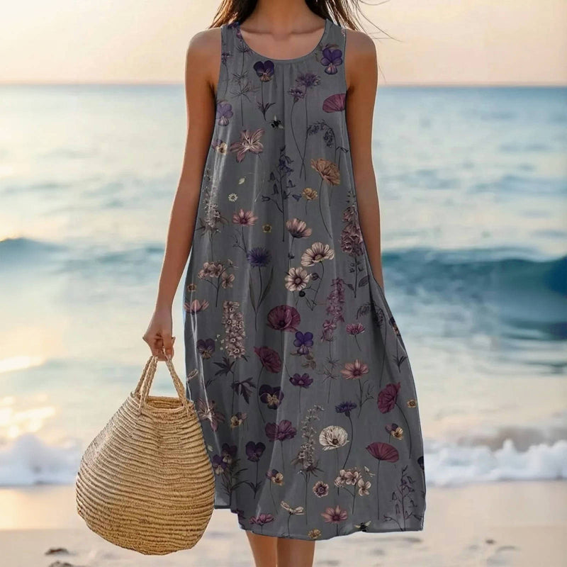 Elegante vintage dames zomerjurk met veelkleurige bloemenprint, perfect als strandjurk, feestjurk of casual maxi-jurk.
