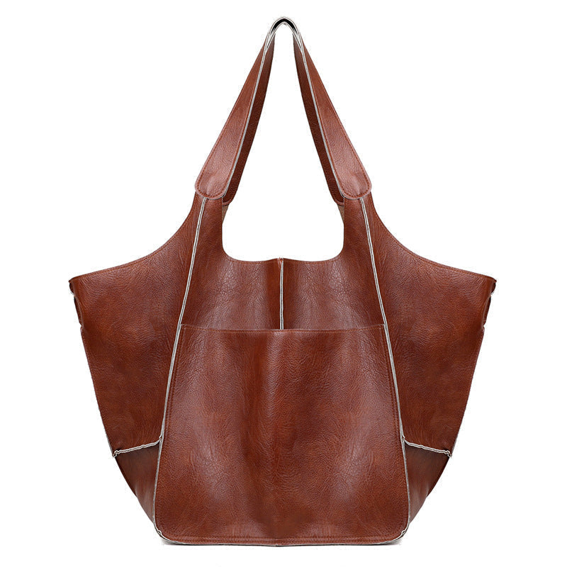 Stijlvolle dames schoudertas, vintage esthetiek, oversized, perfect voor werk of vrije tijd.