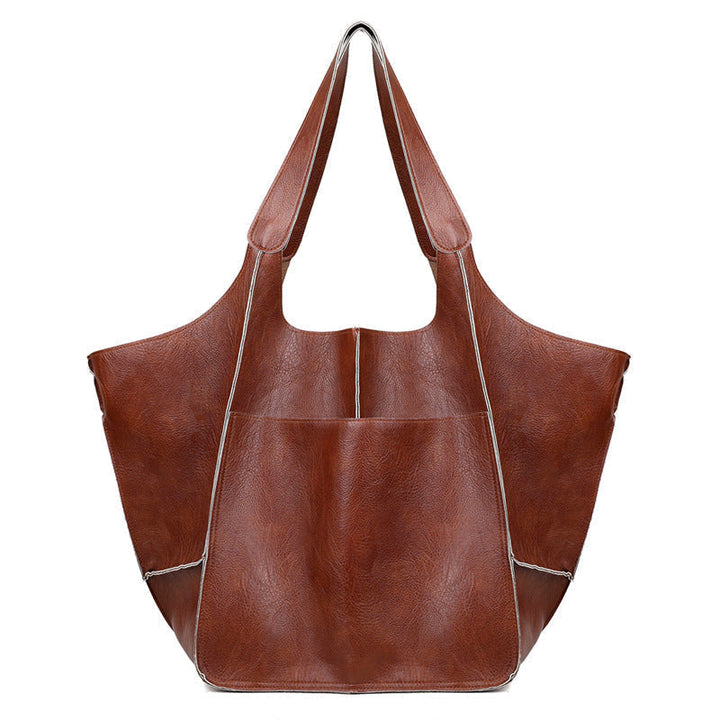 Stijlvolle dames schoudertas, vintage esthetiek, oversized, perfect voor werk of vrije tijd.