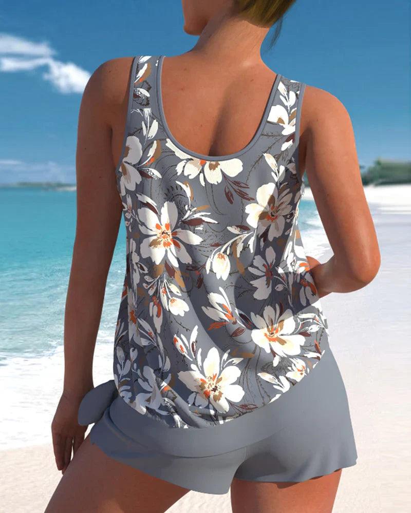 Blauwe tweedelige tankini badpakset voor dames, met elegante top en bijpassende boyshort. Perfect voor de zomer.