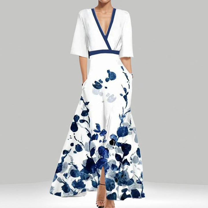 Veelzijdige dames zomerjurk met bloemenprint en korte mouwen. Geschikt als casual, strand- of vakantie jurk.