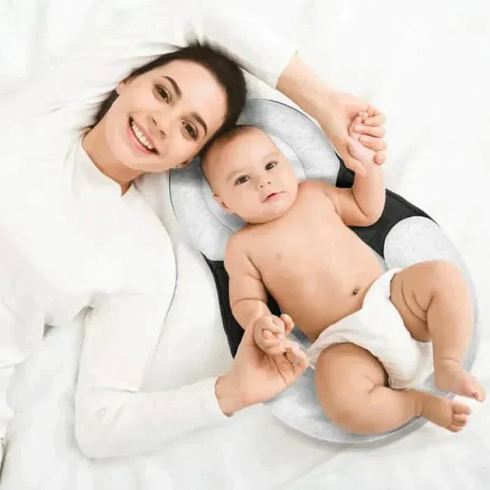 Ergonomisch baby slaapkussen ter voorkoming van afgeplat hoofdje. Essentieel voor veilige rugligging.