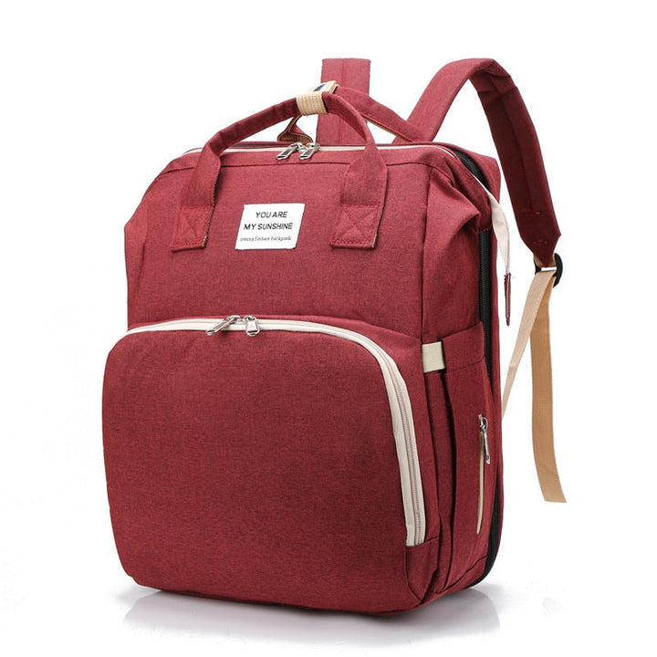 Compacte unisex reisrugzak met geïntegreerd babybed, perfect voor kinderwagen en onderweg.