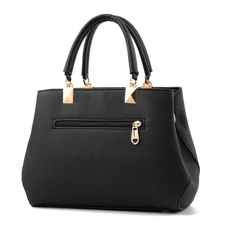 Veelzijdige roze dames handtas met strik, te dragen als crossbody of schoudertas, van duurzaam kunstleer.