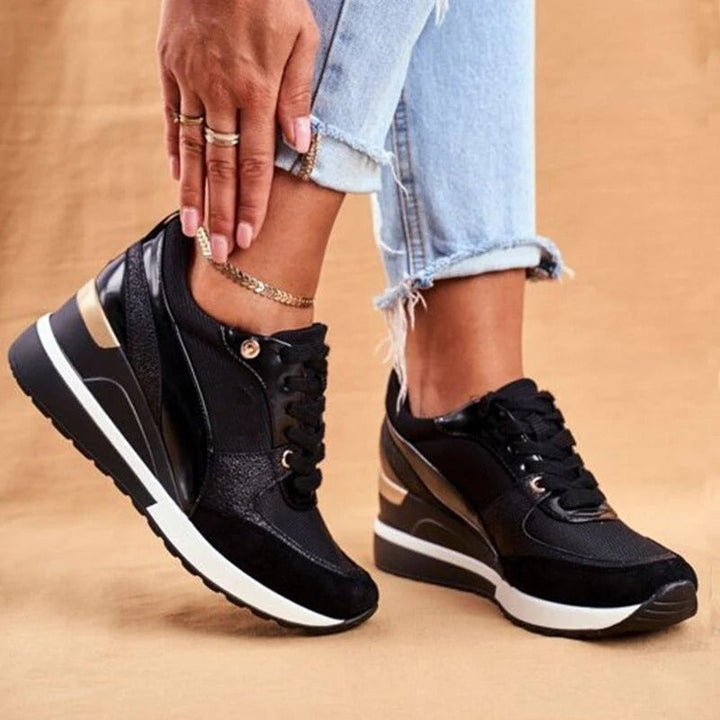 Orthopedische damessneakers met corrigerende zool voor houdingscorrectie, zwart-gouden design en antislip.