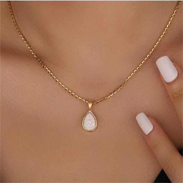 Schitterende natuurlijke opaal hanger aan een fijne 18K gouden ketting. Uniek edelsteen sieraad.