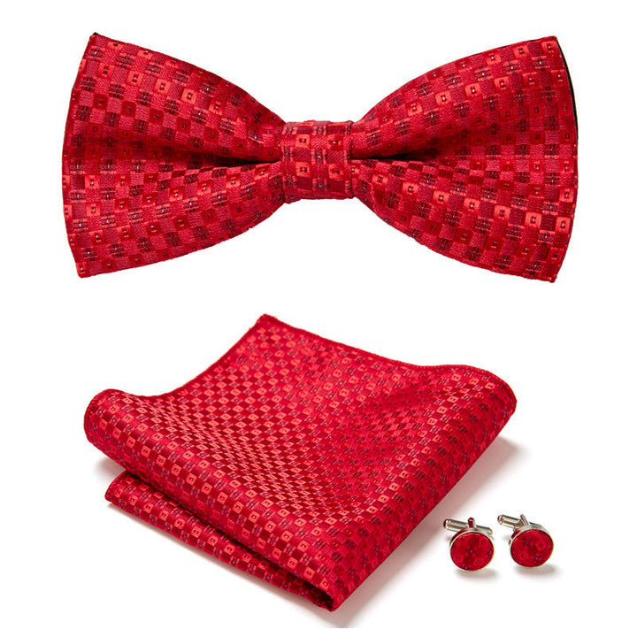 Hoogwaardige heren vlinderstrik set met fijn bloemenpatroon, pochet en manchetknopen. Essentieel voor herenkleding.