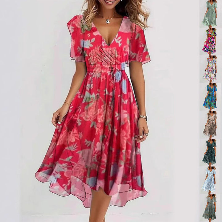 Damesjurk met bloemenprint, V-hals en elegant A-lijn model. Perfect voor de zomer.