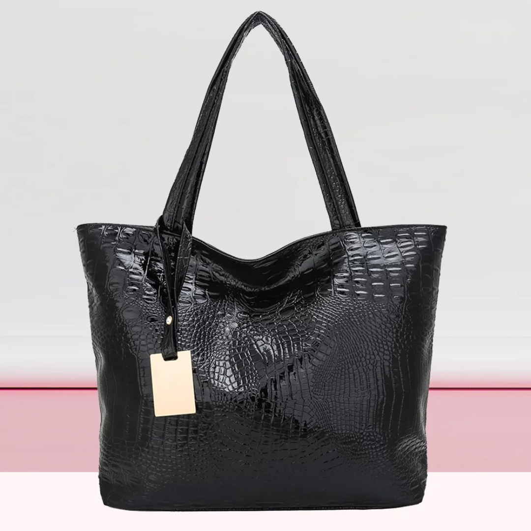 Dames Isabella schoudertas: ruim model van synthetisch leer met stijlvolle krokodillenprint.