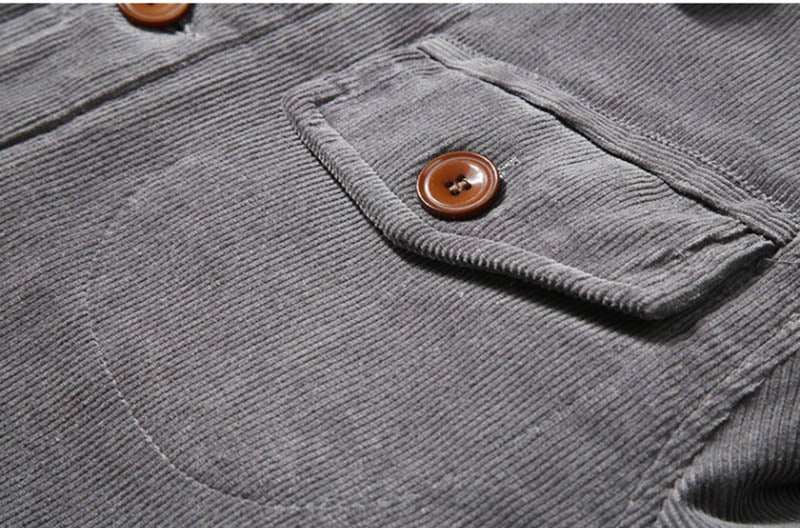 Detailopname van het ribfluweel herenjack, toont de unieke textuur en stijlvolle afwerking.