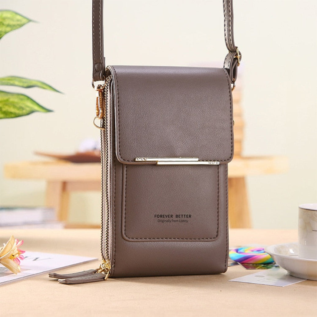 Multifunctionele compacte dames handtas, ideaal als reistas of feesttas, met speciaal telefooncompartiment.