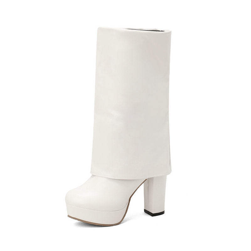 Halfhoge dameslaarzen met plateauzool en blokhak, ontworpen voor comfort en een elegante, tijdloze uitstraling.