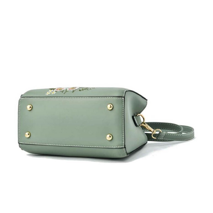 Stijlvolle Flora handtas voor dames met uniek borduurwerk design. Een modieuze crossbody tas.