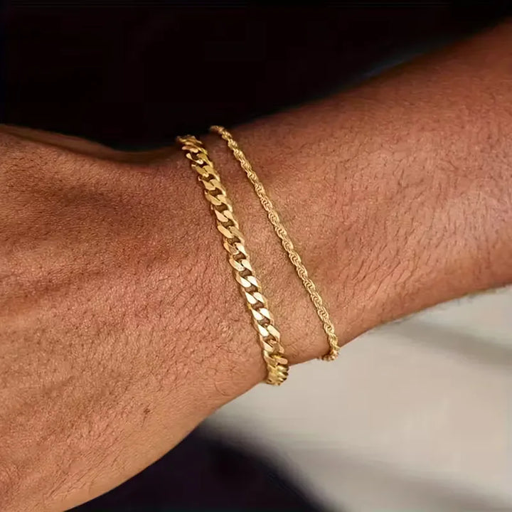 Twee stijlvolle heren armbanden: zilverkleurige Cuban Link en goudkleurige Rope Chain. Trendy schakel- & touwarmbanden.