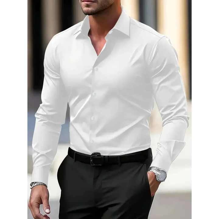 Effen slim fit herenoverhemd met lange mouwen en klassieke kraag. Simpel, elegant en een must-have in elke kast.
