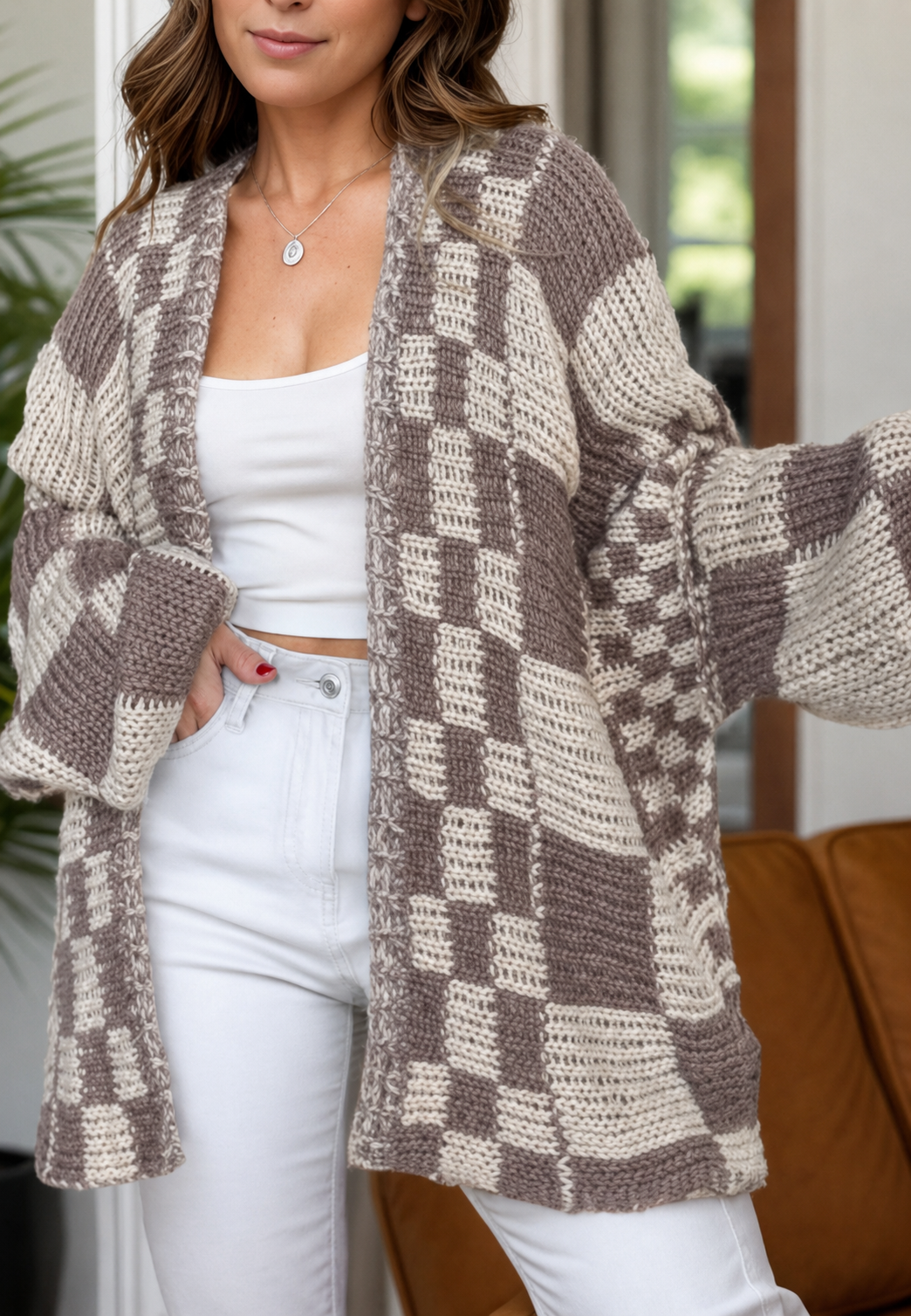Modieus oversized damesvest met comfortabele lange mouwen en chic ruitjespatroon, ideaal voor casual looks.