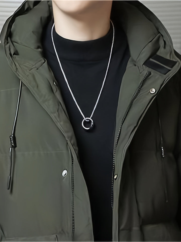Heren winterparka, zwart en gewatteerd, biedt maximale warmte en comfort.