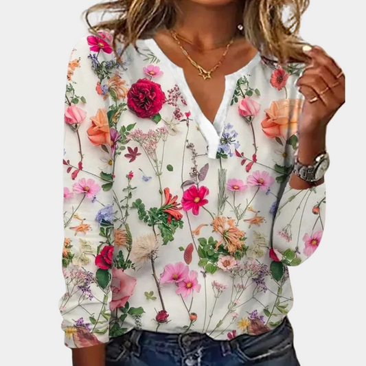 "Casual gebloemde damesblouse met levendig bloemmotief, luchtig ontwerp, ideaal voor lente en zomer."