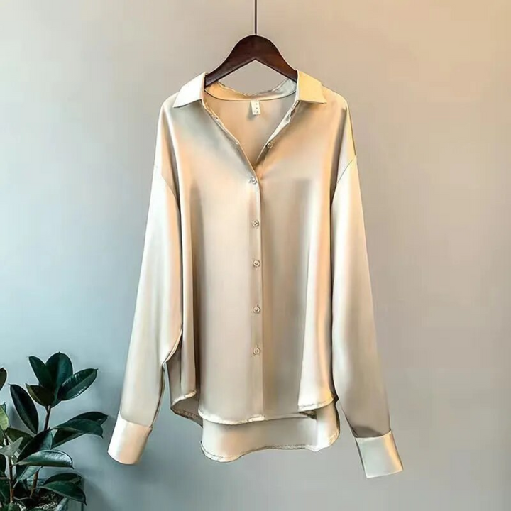 Damesblouse retro stijl. Klassieke, losvallende top met lange mouwen. Elegant en veelzijdig, perfect voor dagelijkse mode.