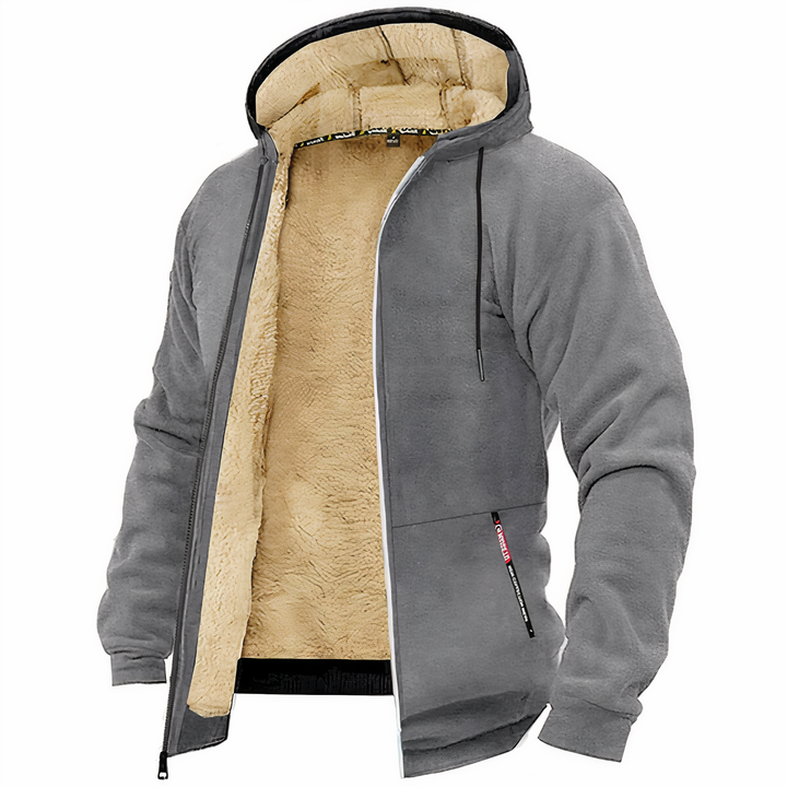 Man draagt een warm en comfortabel heren sweatvest met capuchon en rits, casual look.
