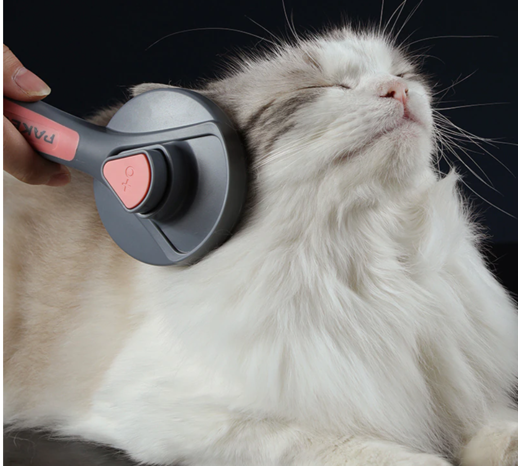 Ergonomische premium huisdierborstel voor comfortabele vachtverzorging, ontwollen en massage bij kat & hond.