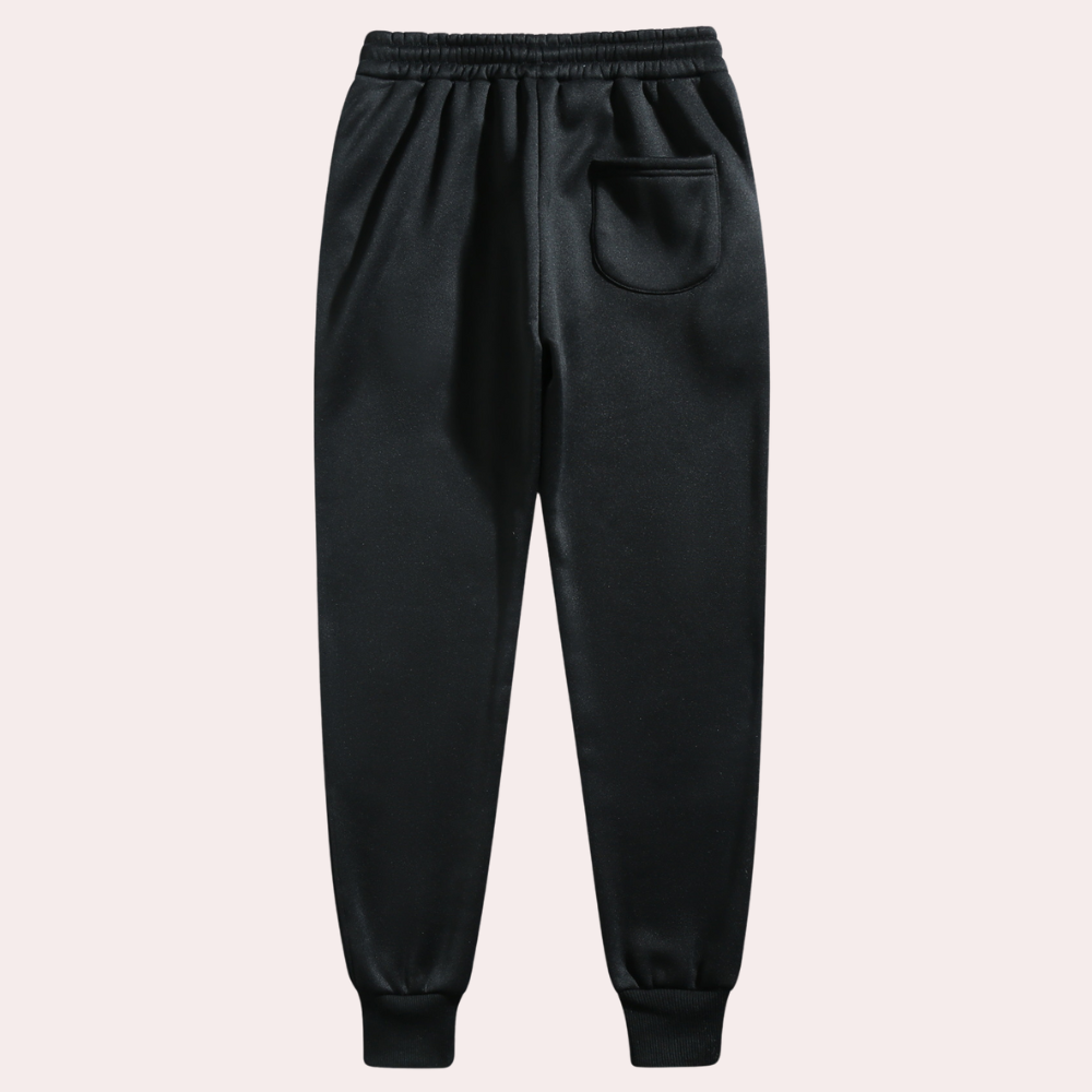 "Comfortabele heren joggingbroek met baggy pasvorm, grijs van kleur, verstelbare tailleband, ideaal voor sport en casual."