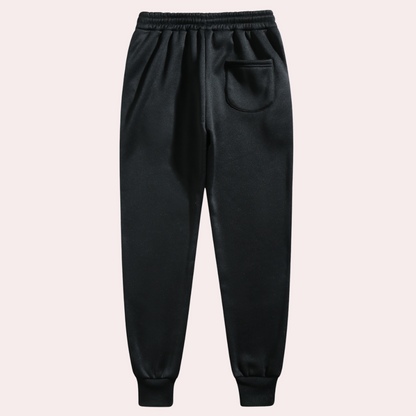 "Comfortabele heren joggingbroek met baggy pasvorm, grijs van kleur, verstelbare tailleband, ideaal voor sport en casual."
