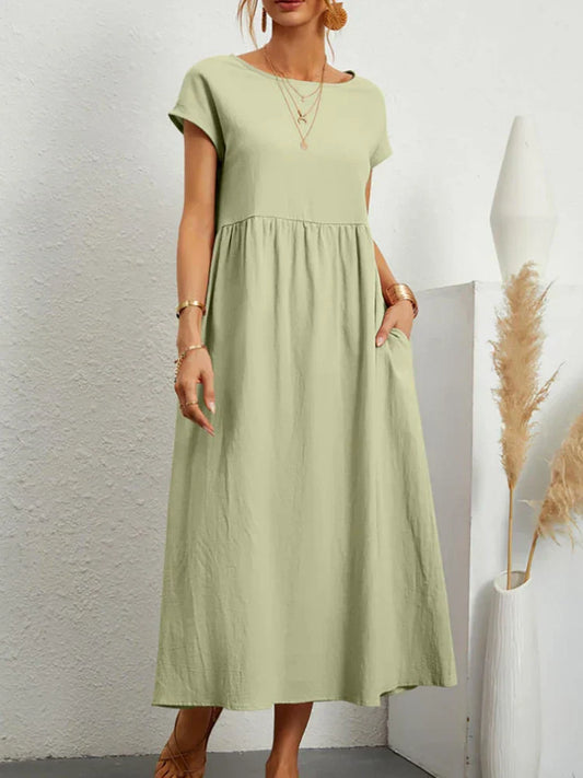 "Comfortabele vintage O-hals zomerjurk van ademend katoen, ideaal voor zomerse dagen; veelzijdige elegante stijl."