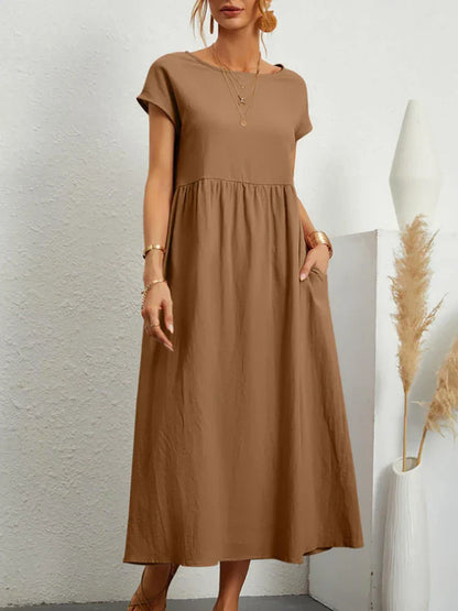 "Comfortabele vintage O-hals zomerjurk van ademend katoen, ideaal voor zomerse dagen; veelzijdige elegante stijl."