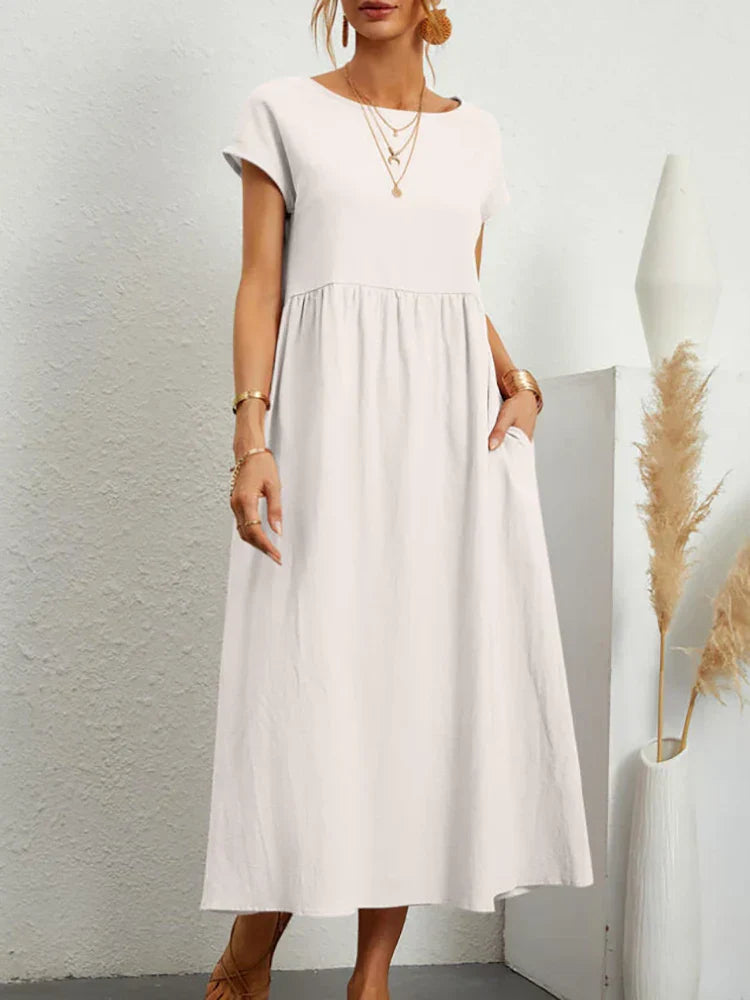 "Comfortabele vintage O-hals zomerjurk van ademend katoen, ideaal voor zomerse dagen; veelzijdige elegante stijl."