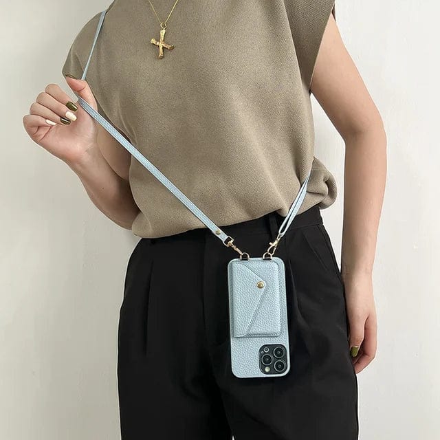 Lichtblauw lederen telefoonhoesje met pasjesvakken, crossbody koord en gouden accenten voor dames.