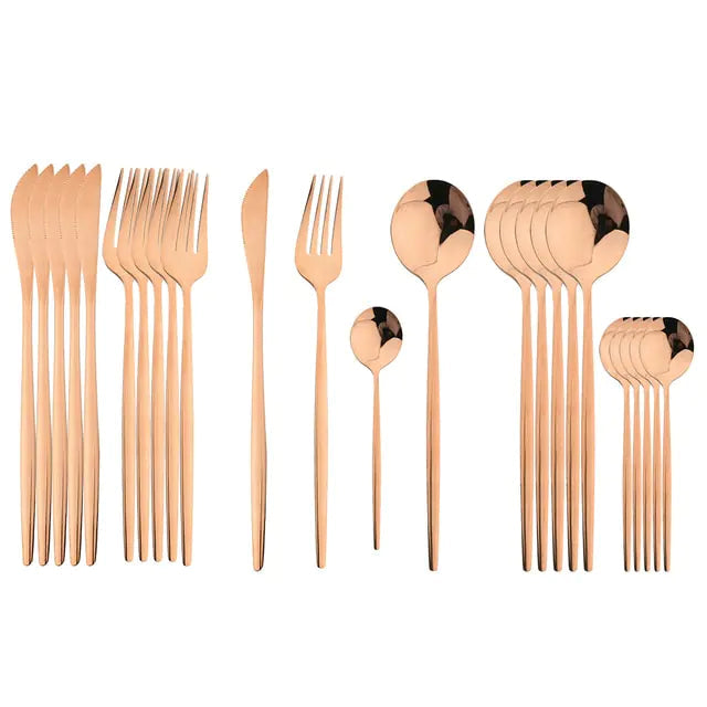 Zwarte 24-delige RVS bestekset Aurinox, elegant mat servies voor een moderne eettafel.