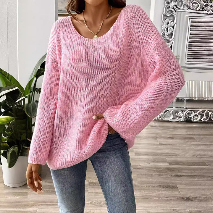Roze gebreide damestrui met wijde ronde hals. Comfortabele, casual en stijlvolle roze trui met lange mouw.