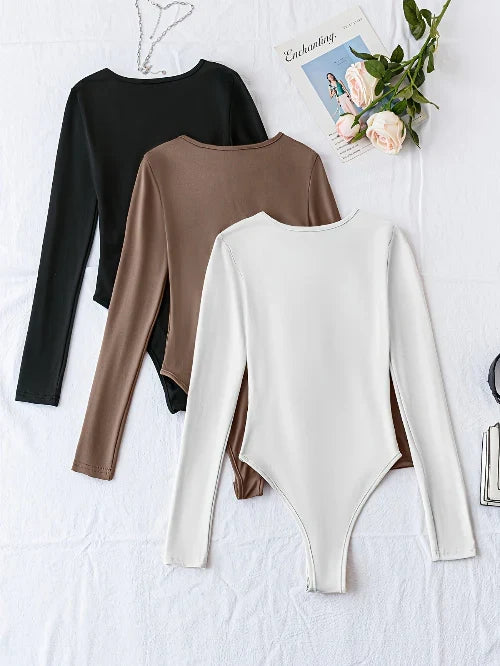 Hoogwaardige damesbodysuits met lange mouw, effen en crewneck. Een modieus en comfortabel 3-pack.