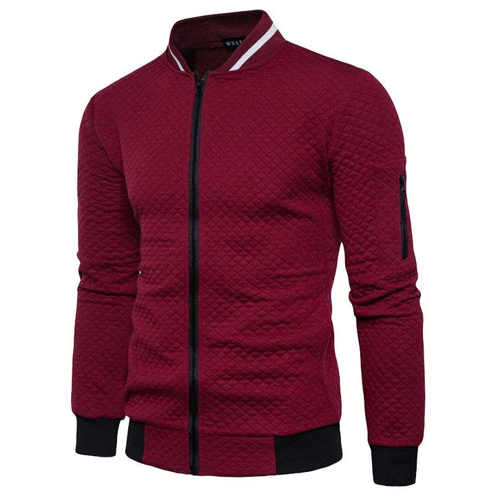 Warm gewatteerd herenjack met rits en opstaande kraag. Een comfortabel en modern vest voor herfst/winter.