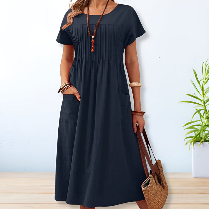 Elegante dames A-lijn midi jurk met korte mouwen en ronde hals, perfect voor zomerse dagen. Comfortabel en veelzijdig.