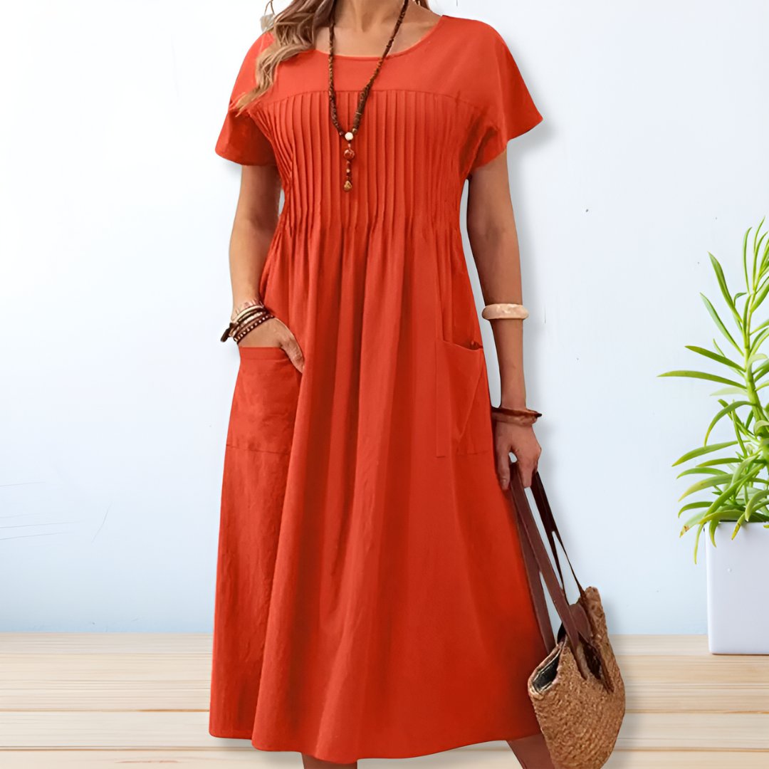Stijlvolle dames midi jurk in A-lijn model met korte mouwen. Geschikt als elegante of casual jurk, ideaal voor elk seizoen.