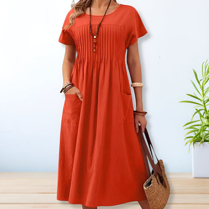 Stijlvolle dames midi jurk in A-lijn model met korte mouwen. Geschikt als elegante of casual jurk, ideaal voor elk seizoen.