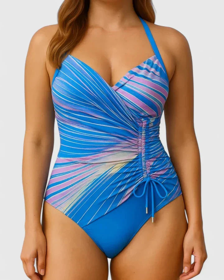 Eenstuks dames badpak, zwemkleding, met V-hals en wikkelbovenstuk, voorzien van verstelbare zijkoorden.