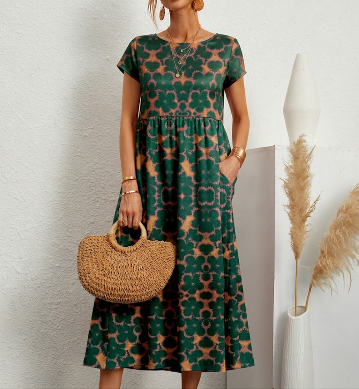 Stijlvolle dames A-lijn jurk, midi lengte, met elegante bloemenprint en comfortabel ontwerp voor lente/zomer.