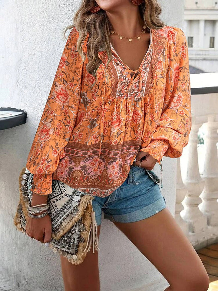 Stijlvolle dames top met elegante bloemenprint en lange mouwen. Perfect voor een vrouwelijke uitstraling.
