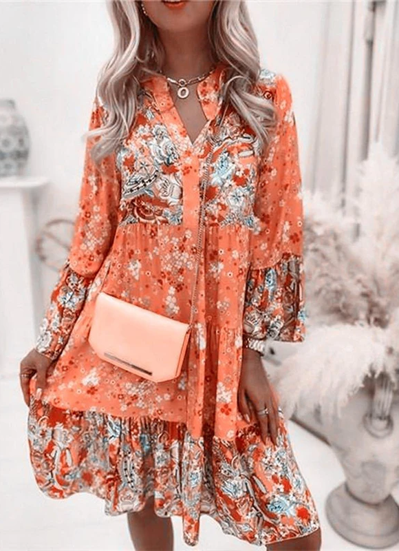 Trendy boho dames minijurk met vrolijke bloemenprint en V-hals. Ideale casual lente/zomer jurk voor dames.
