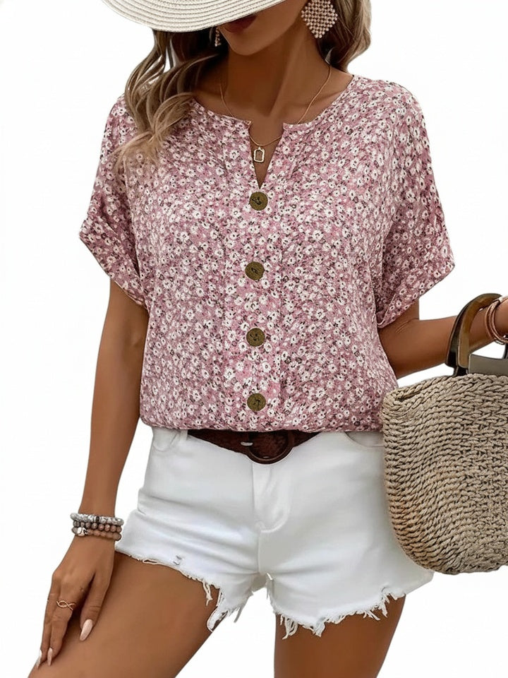 Dames zomerbloes met elegante bloemenprint en korte mouwen. Casual oversized blouse voor lente/zomer comfort.