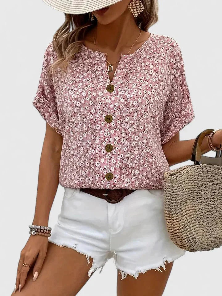 Vrouwen bloemenblouse met korte mouwen en knoopsluiting. Comfortabele, casual top perfect voor warme zomerdagen.
