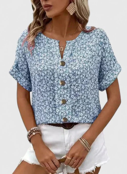 Lente/zomer damesblouse met vrolijke bloemenprint. Comfortabele, casual kleding voor elke vrouw op zomerse dagen.
