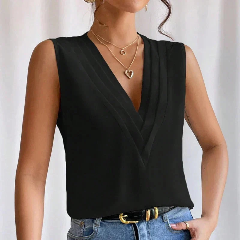 Formele dames blouse: mouwloos, V-hals, comfortabel en professioneel voor werk.