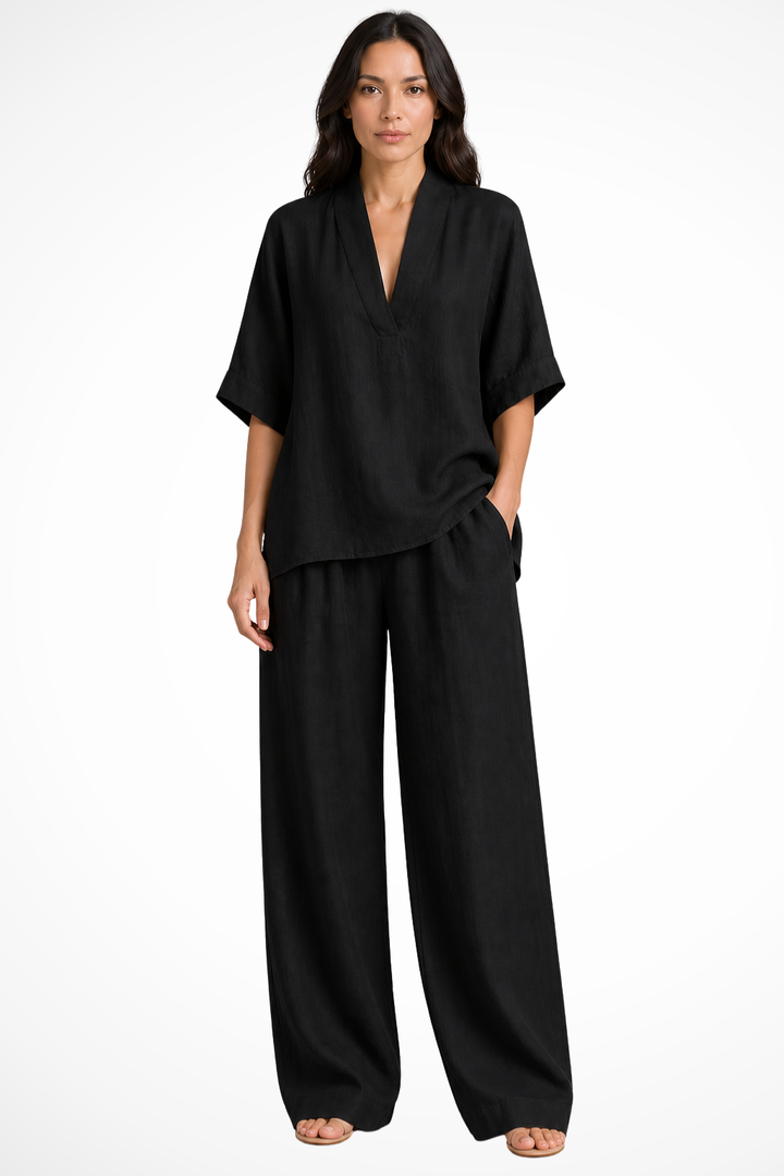 Dames tweedelige co-ord set met oversized V-hals top en wijde pijpen broek, comfortabel en stijlvol.