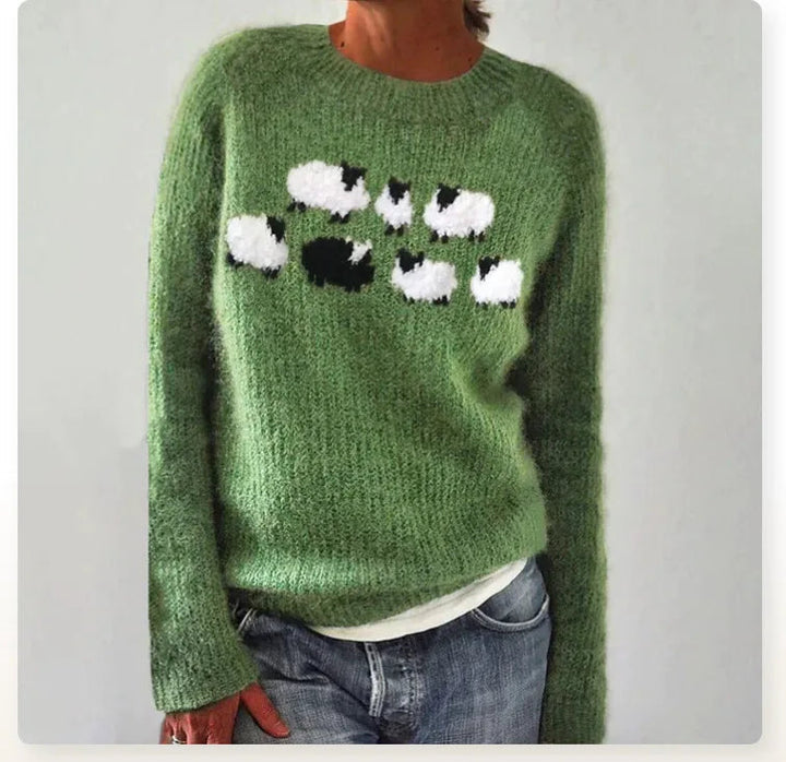 Close-up: Detail van zachte gebreide dames trui met vintage patroon. Toont de textuur en het unieke design.